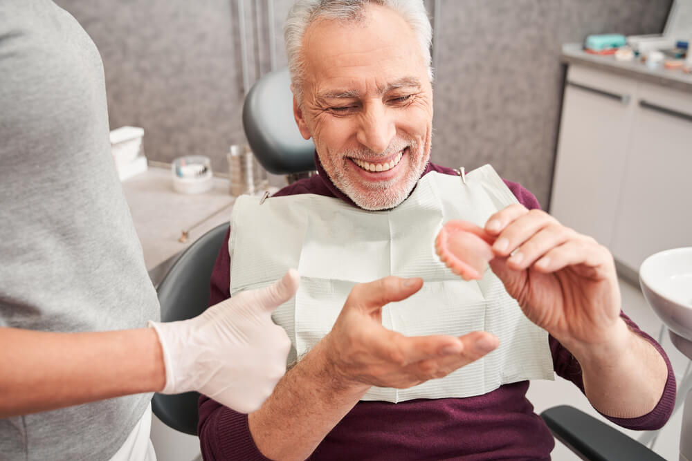 Man getting his new dentures